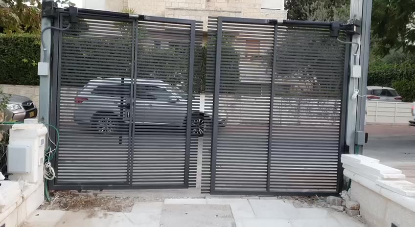 וידאו: שער כנף חשמלי עם מנועי זרוע נפתח בכניסת בית | שפירא מערכות